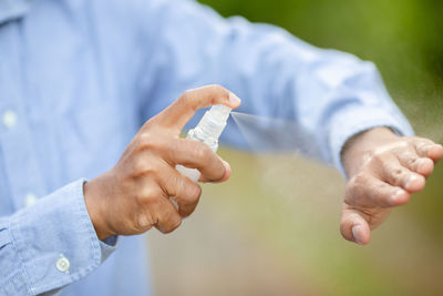 Close-up of hand holding ice cream