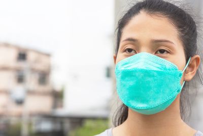 Woman wearing a mask to prevent dust and bacteria