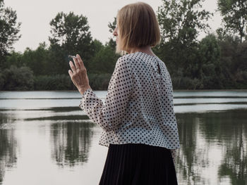 Rear view of woman using mobile phone