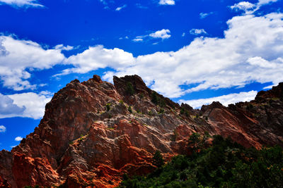 Scenic view of mountains against cloudy sky