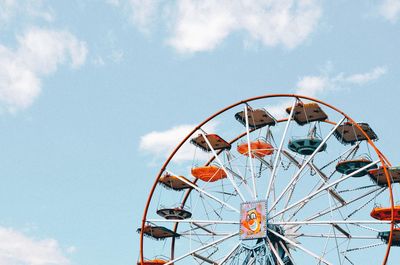 Low angle view of ferris wheel against sky