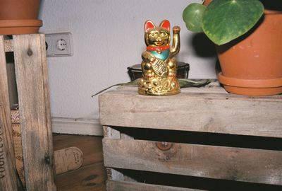 Close-up of figurine on table at home