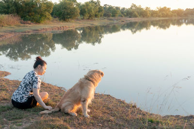 Side view of a dog on lakeshore