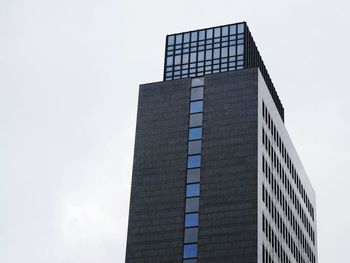 Low angle view of skyscraper against sky