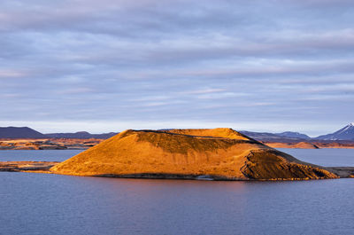 One of the pseudocraters at the southern shore of lake myvatn, illuminated by warm sunlight 
