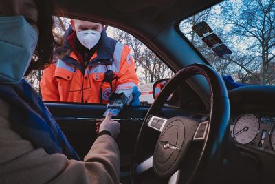 Man sitting in car