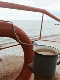 Close-up of coffee cup on table