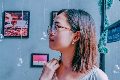 Portrait of young woman looking away