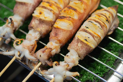 High angle view of meat on barbecue grill