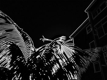 Low angle view of building against sky at night