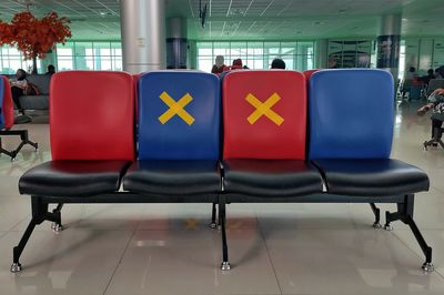 Empty chairs and tables at airport