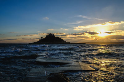 Scenic view of sea against sky at sunset