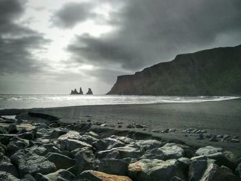 Scenic view of sea against cloudy sky