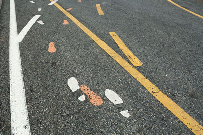Full frame shot of footprints on road