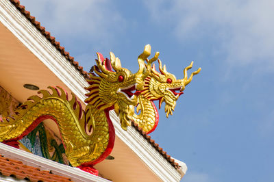 Low angle view of multi colored temple against sky