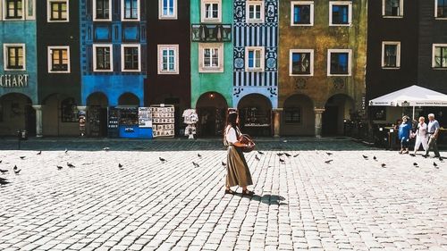 View of woman walking in city