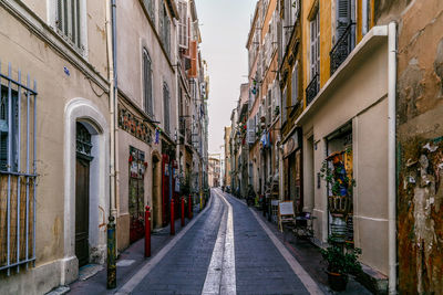 Street amidst buildings against sky