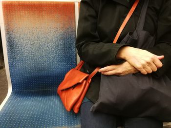 Close-up of man sitting on floor