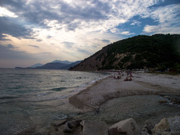 Scenic view of beach against sky during sunset