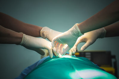 Cropped hand of doctor examining patient