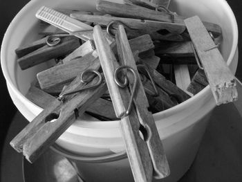 High angle view of clothespins in bucket at home