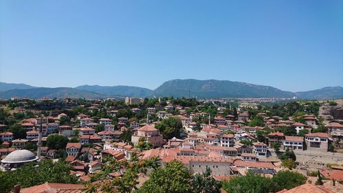 Townscape against clear blue sky