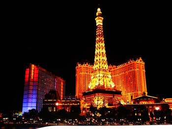 Low angle view of illuminated buildings at night