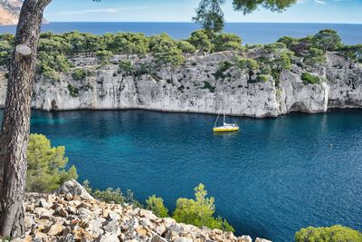 Sailboat in the middle of cassis calanque in provence