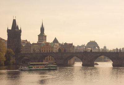 Charles bridge over vltava river and prague skyline 