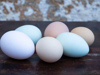 Close-up of eggs in row on table