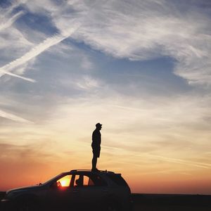 Silhouette of people at sunset