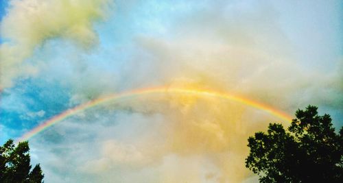 Low angle view of rainbow against sky