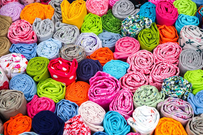 Detailed close up view on samples of cloth and fabrics in different colors found at a fabrics market