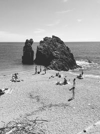 High angle view of people at beach on sunny day