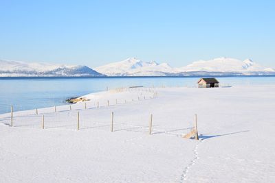 Scenic view of sea against sky during winter