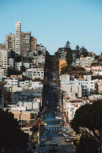 Buildings in city against clear sky