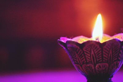 Close-up of illuminated candle