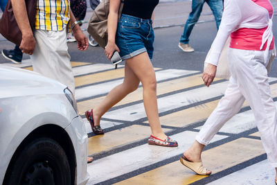 Low section of people crossing road