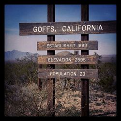 Low angle view of road sign against sky