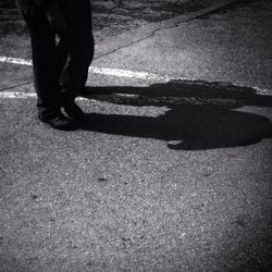 Shadow of people on road