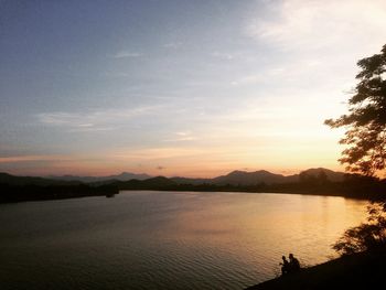 Scenic view of lake against sky during sunset