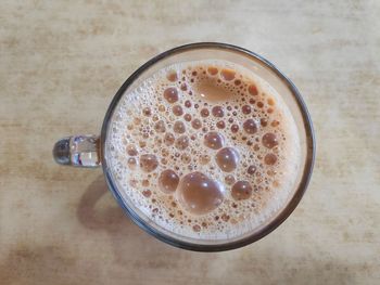 High angle view of coffee cup on table