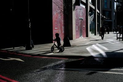Low section of woman walking on street
