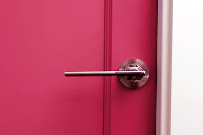Magenta painter door with handle close-up. vivid color