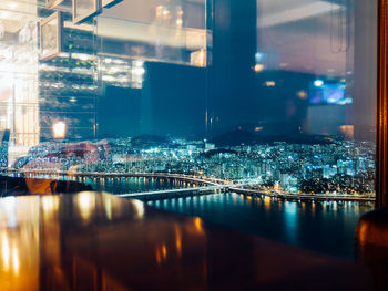 Reflection of illuminated buildings in water