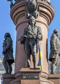 Low angle view of statue against sky