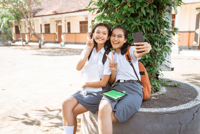 Young woman using phone