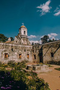 Low angle view of historic building against sky