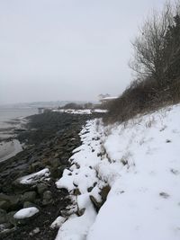 Scenic view of frozen lake against clear sky