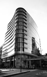 Low angle view of modern buildings against clear sky